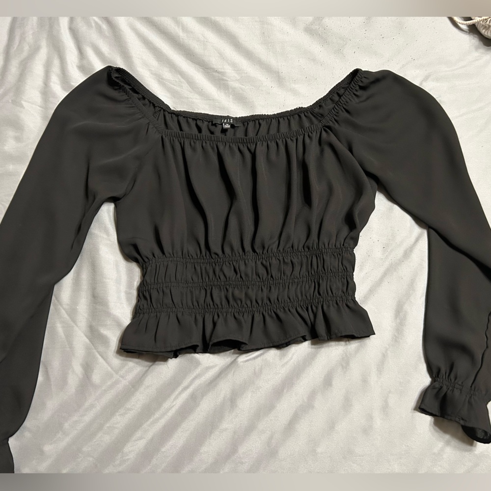 Women’s blouse size medium.